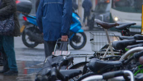 Medium-Shot-of-Pedestrians-Walking-In-Rain-