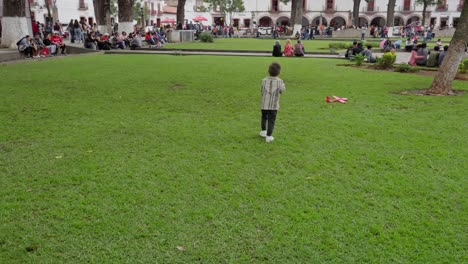 A-kid-in-the-main-square-of-Patzcuaro-at-the-balloon-festival