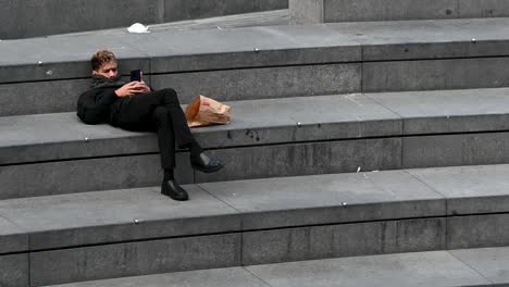 Relaxing-on-the-floor,-London,-United-Kingdom