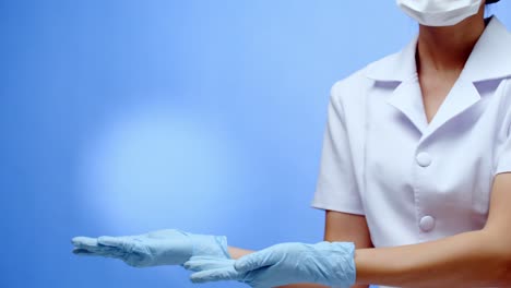 A-nurse-forms-a-heart,-love-symbol,-with-her-hands-and-fingers-then-displays-copy-space-for-your-message