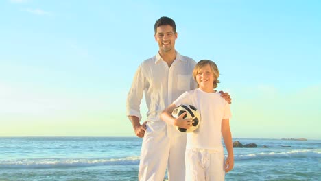 Father-and-son-posing-on-a-beach