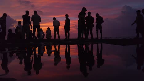Silhouette-and-Reflection-of-People-Watching-the-Sunset-Slow-Motion