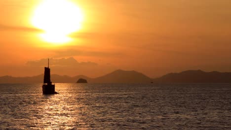 Asian-Sailboat-Floating-on-the-Sunset-Waters